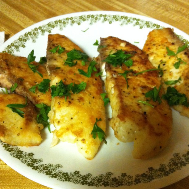 Tilapia filets with parsley. Lemon butter sauce cooking on… Flickr