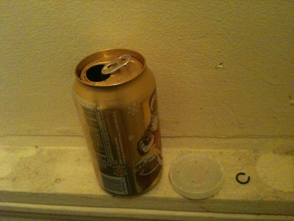 IMG_2518 santa soda can, plastic lid, curl of wire lida Flickr