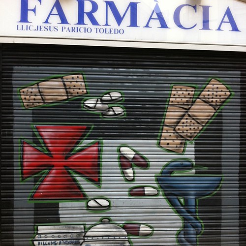 A painted pharmacy gate. Barcelona. turnflux Flickr