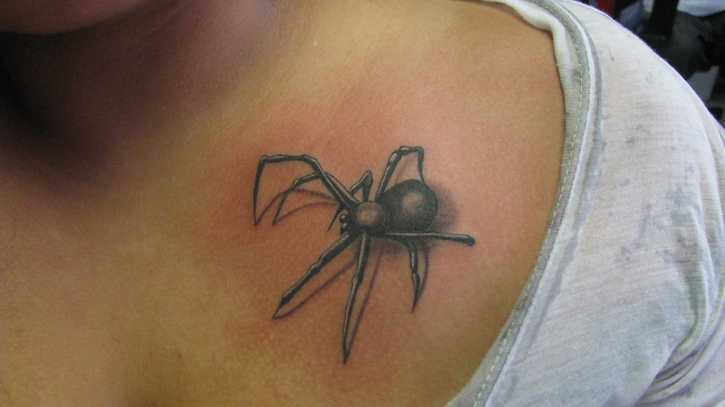 The black widow Tattoo of a black widow spider on chest