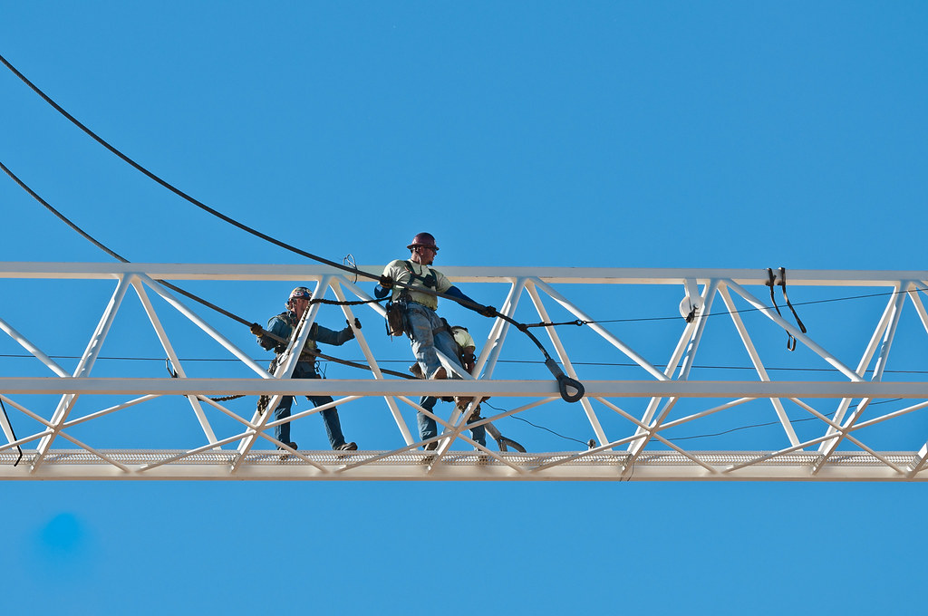 tower crane erectors About 200 feet in the air. on black larkin