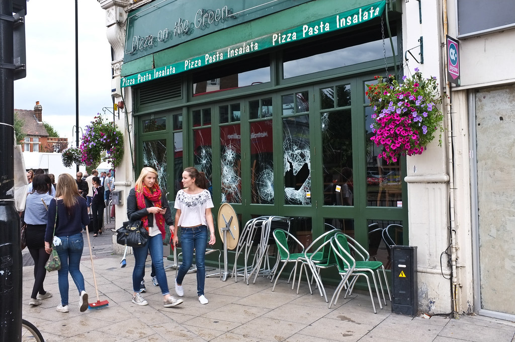 Pizza on the Green Local residents with brooms walk past t… Flickr