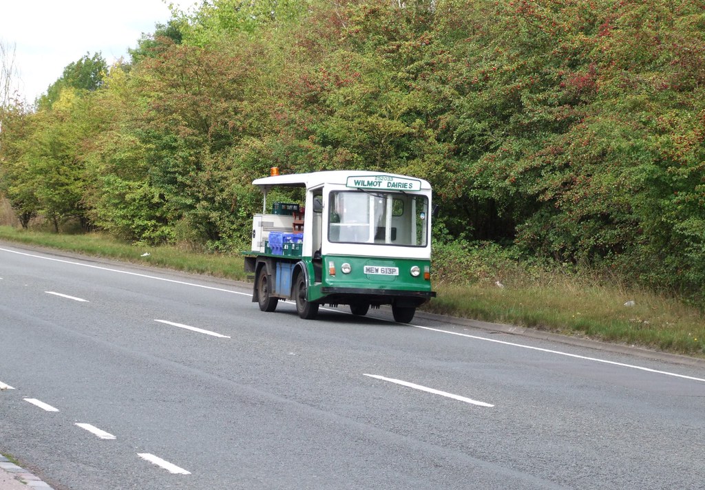 Electric milk float MEW 613P from Wilmot Dairies travelling along the A51 back to base at
