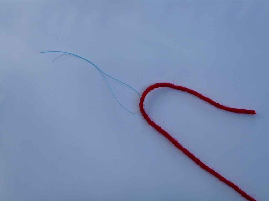 How to use a floss threader to thread beads onto yarn Flickr