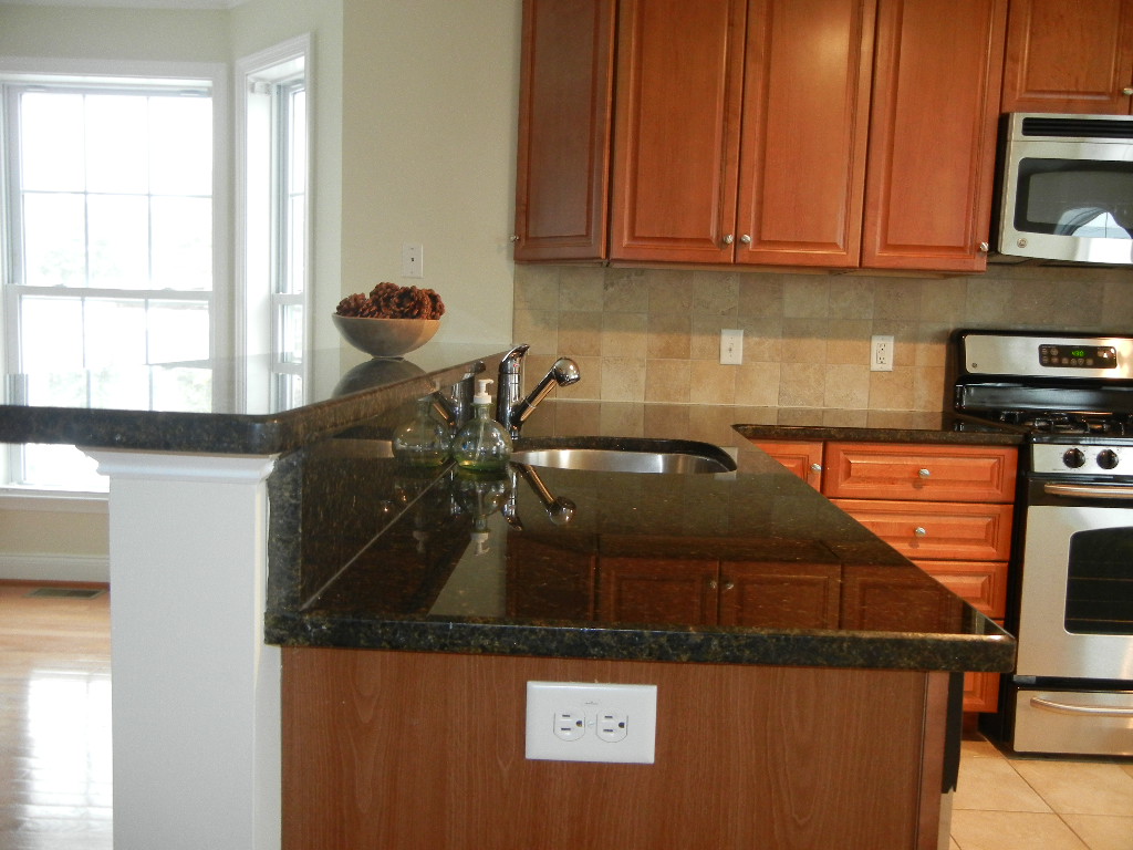 Breakfast Bar Black granite breakfast bar with Moen stainl… Flickr