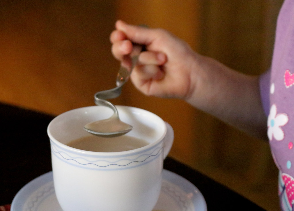 young tea sipper prefers lifting of the spoon wmpe2000 Flickr