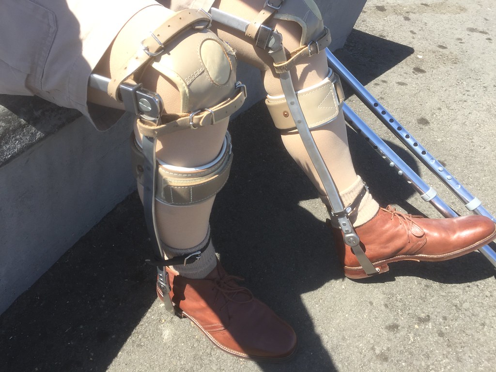 leg braces on a bench at the riverside watched a guy with … Flickr