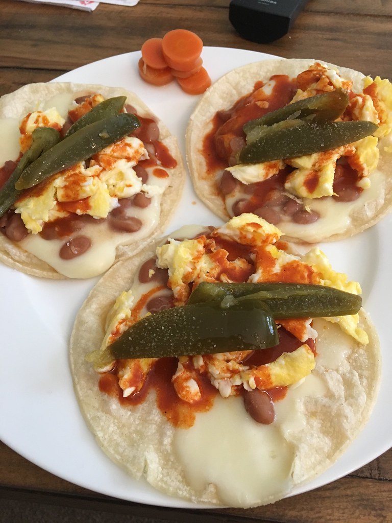 Corn tortilla tacos with eggs, cheese, pinto beans, hot sa… Flickr
