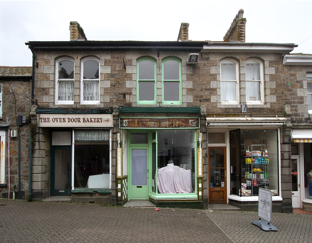 J. C. Rogers Ghost sign and shops at Causewayhead, Penzanc… tarboat