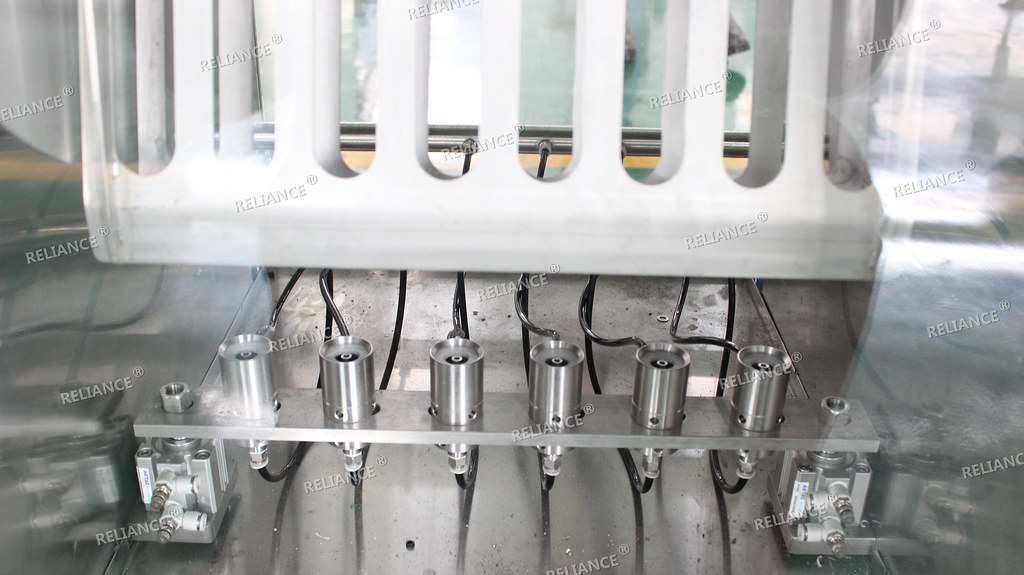 wine and spirit filling capping machine RELIANCE wine bott… Flickr