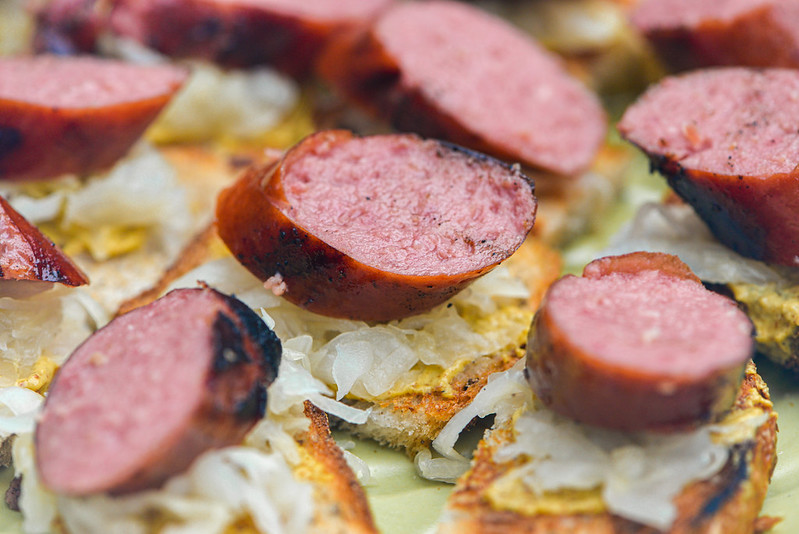 Grilled Kielbasa Sausage on Toasted Rye with Mustard and Sauerkraut