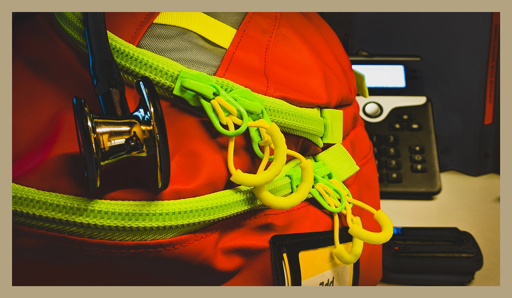 EMT backpack with lots of zippers in customary high vis… Flickr