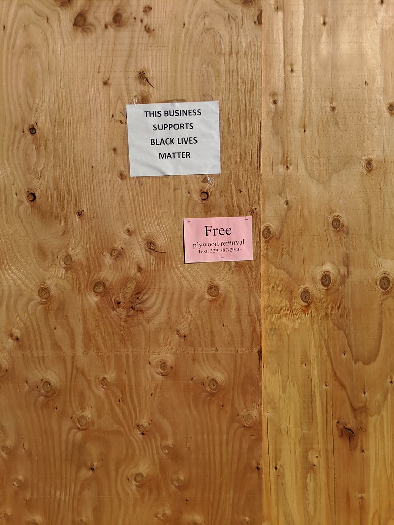 Free plywood removal sign, boarded up storefront, Magnolia… Flickr