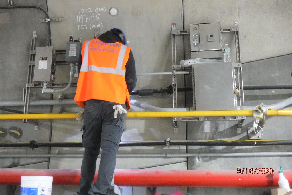Working on electrical parts and equipment in the tunnels i… Flickr