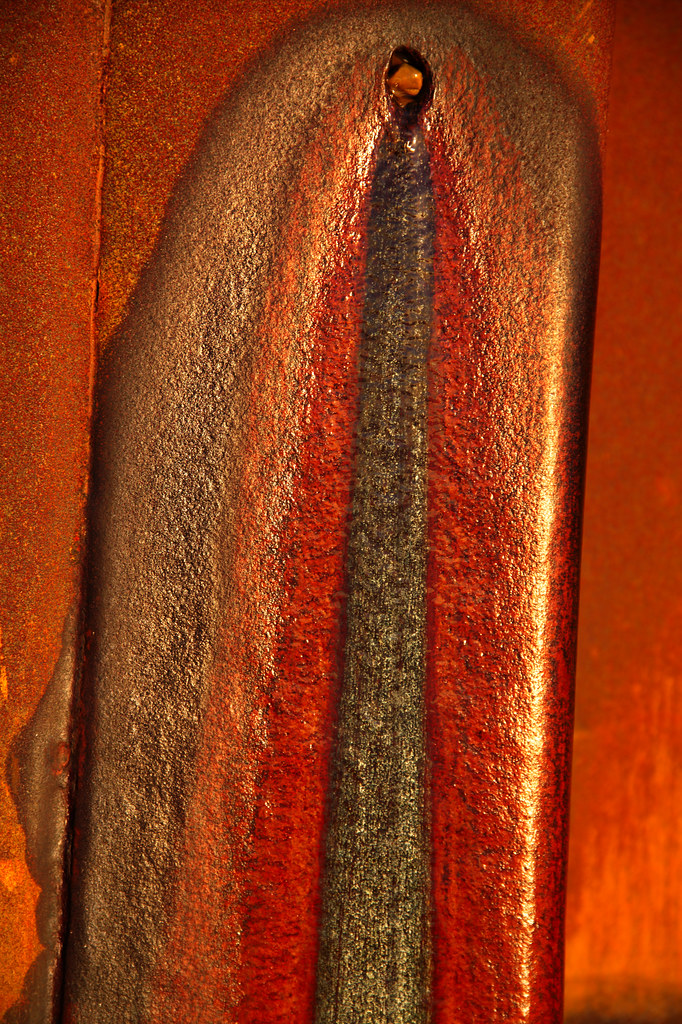 Stain Iron oxides and a glistening biofilm mark the trickl??? Flickr