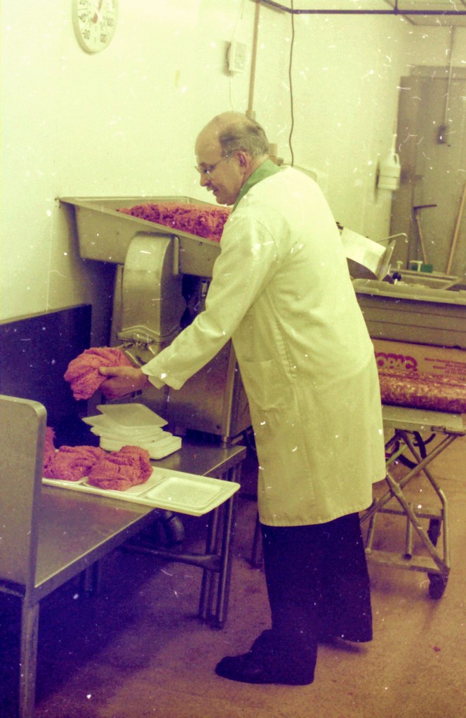Meat Cutter Grinding Meat 1985 Photo I took in 1985 of the… Flickr