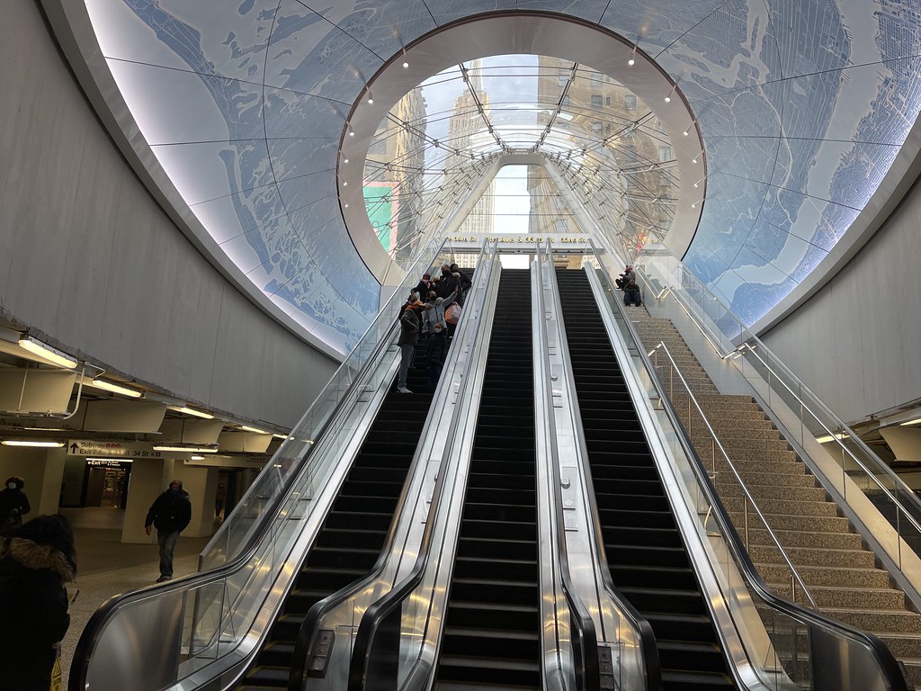 Pennsylvania Station NYC escalator with views of the Empire State