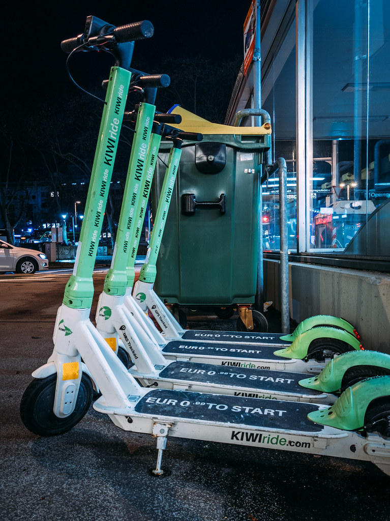 Closeup of Kiwi ride electric scooters for rent parked ne… Flickr