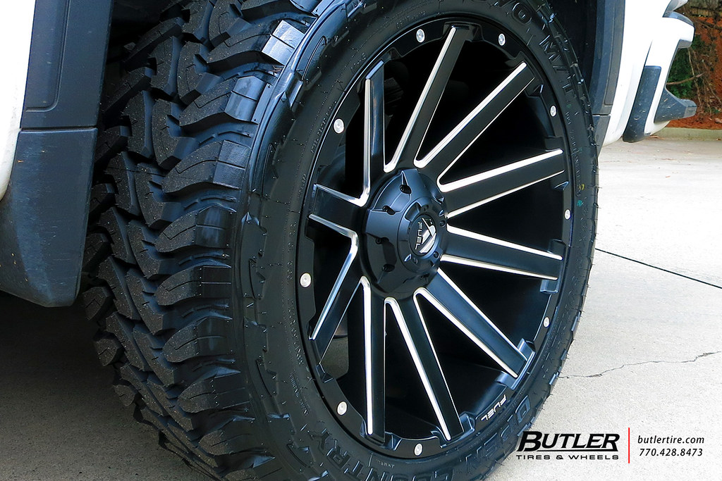 Leveled GMC Sierra AT4 with 22in Fuel Contra Wheels and Toyo Open Country MT Tires a photo on