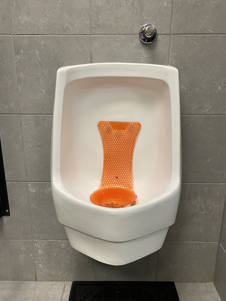 Sloan waterless Urinal with the Bee Mineral oil rest area … Flickr