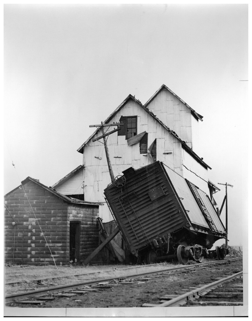 Rail Car and Building Damage, March 1942 Another view of t… Flickr