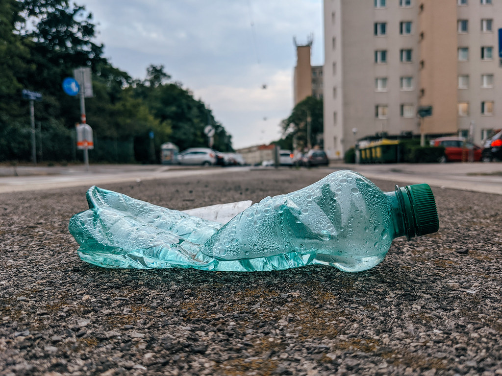 Squished plastic water bottle thrown on the ground Flickr