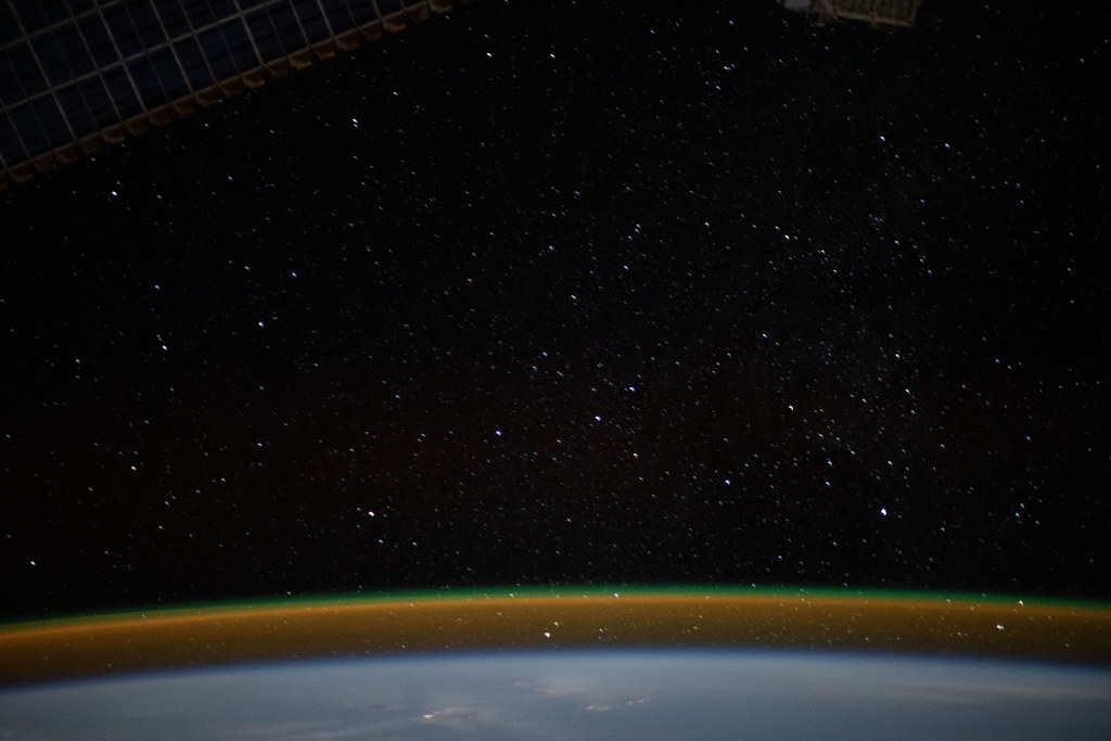 The airglow blankets the Earth's horizon beneath a starry … Flickr