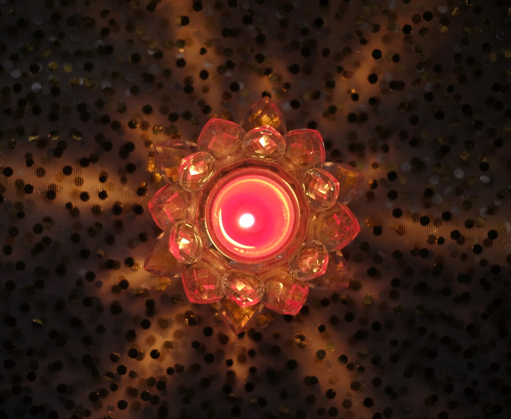 Red candle glow A flower shaped candle holder. zinnia2012 Flickr