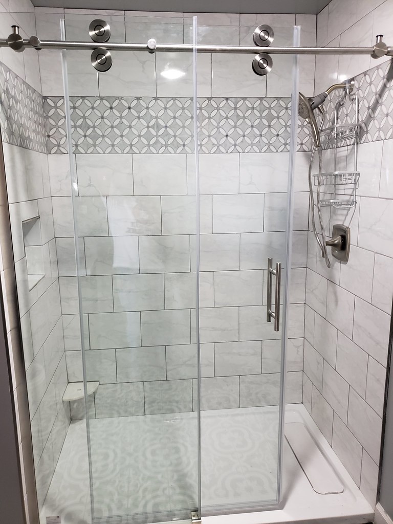Tile shower and glass door Miguel Giron Flickr