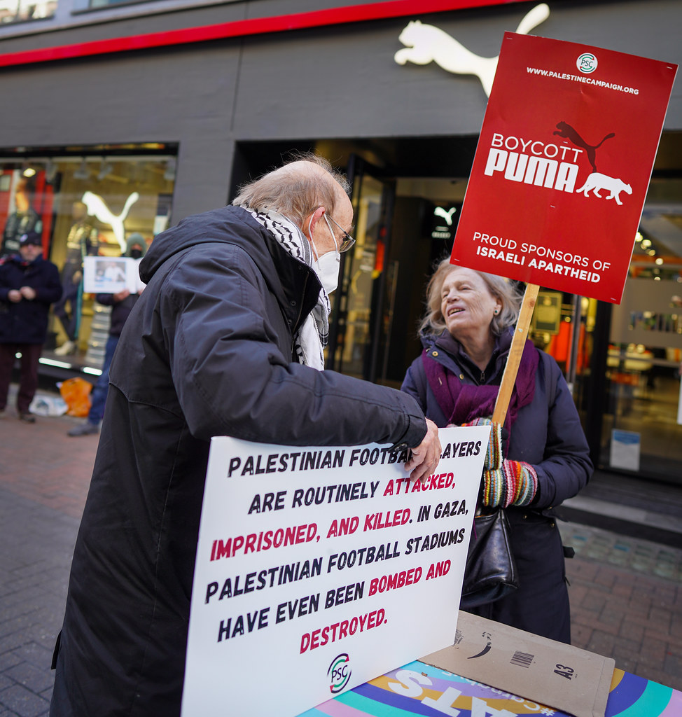 Boycott Puma Protesters chatting outside a Puma store in C… Flickr