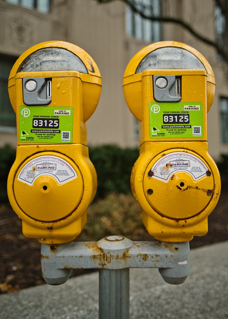Yellow parking meters On St. John's Place, Kalamazoo, MI Flickr