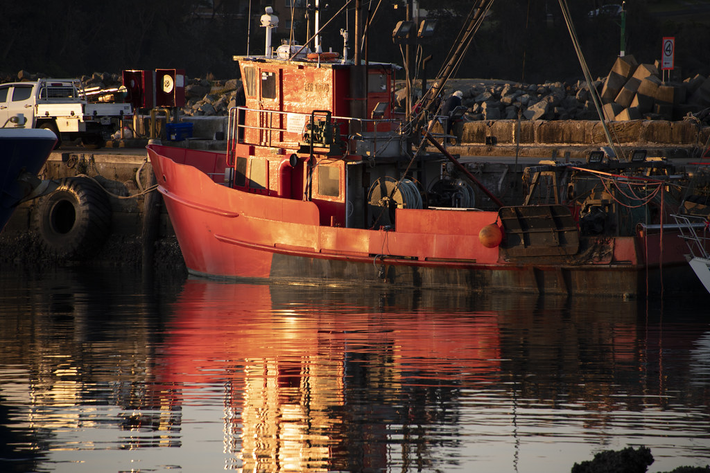 Red fishing boat The town of Ulladulla, on the New South W… Flickr