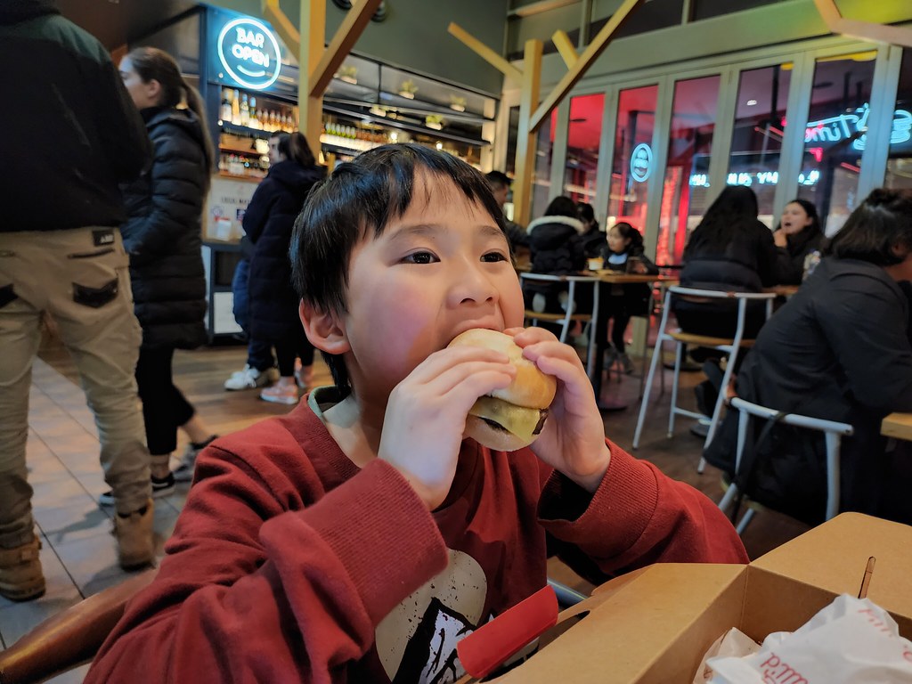 Liam eating a mini burger at Grill'd Chadstone Alpha Flickr