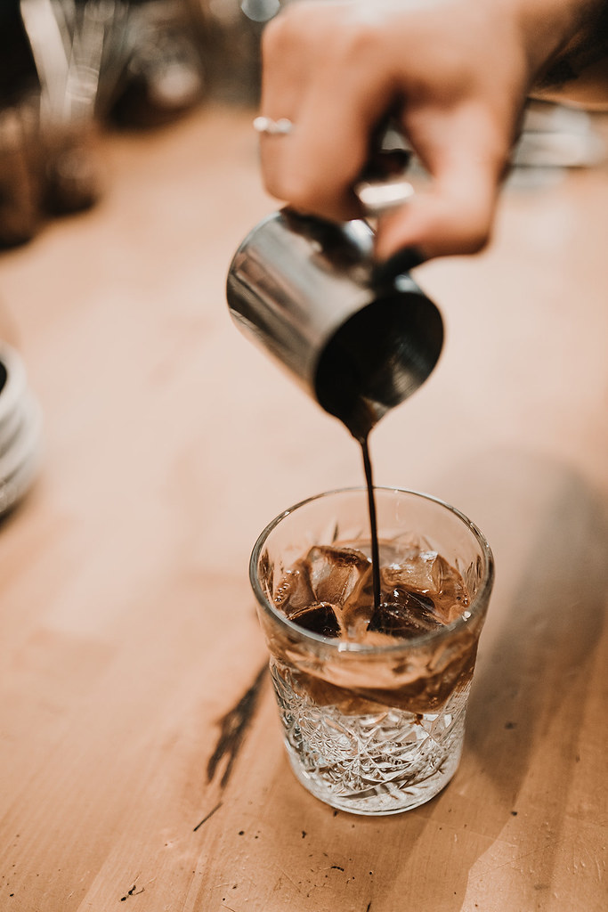 Pouring Espresso Over Ice A barista pouring freshly brewed… Flickr