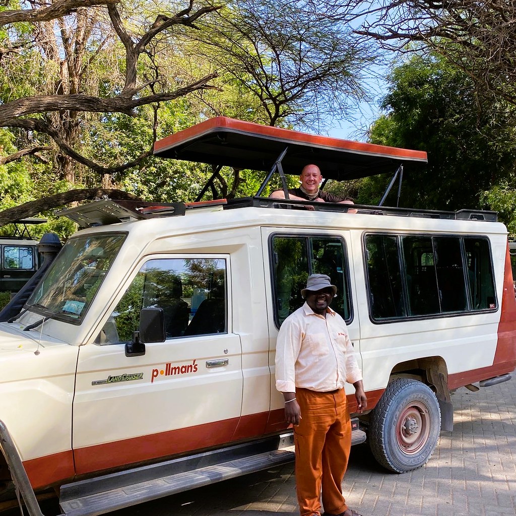 Kenya truck with guide, Dennis Gordon Graham Flickr