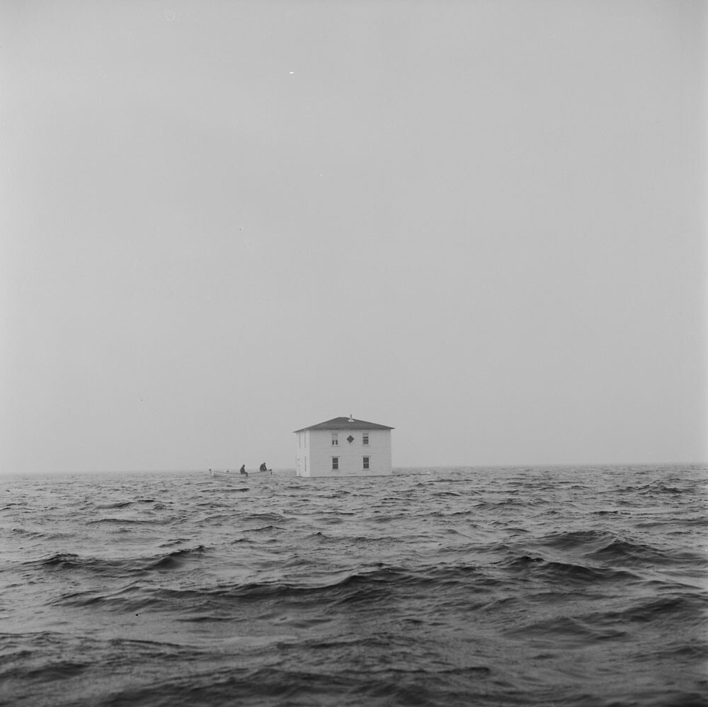 Malcolm Rogers’ house floating on the water, being moved f… Flickr