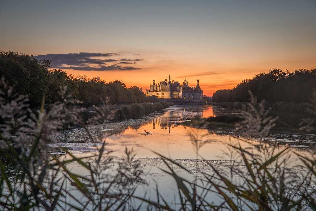 The heron The sunsets at the castle of Chambord (France) a… Flickr