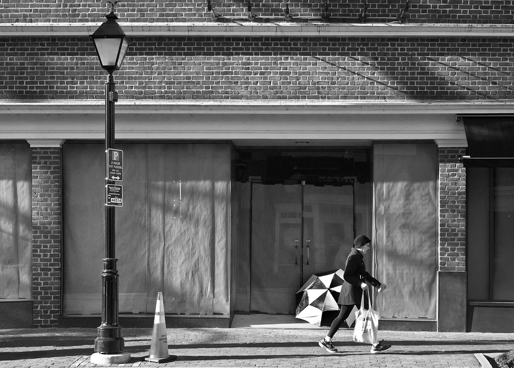 passing umbrella home Helen Sampson Flickr