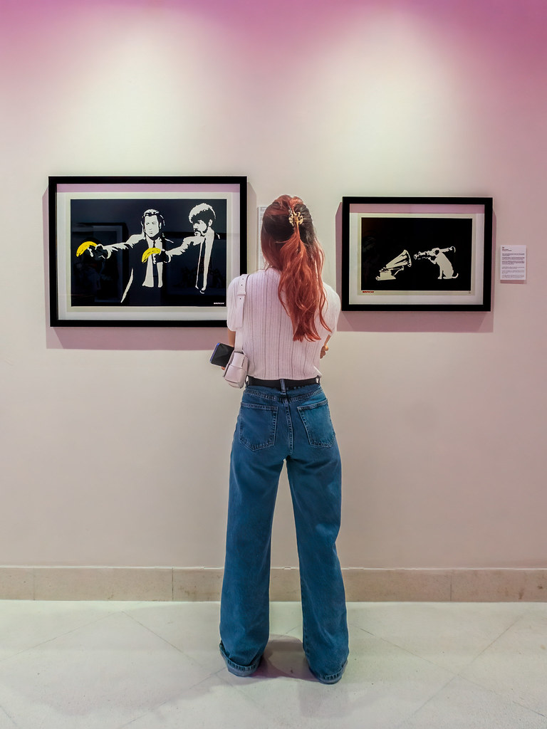 Admire Reading the meaning of one of the Banksy works at M… Flickr