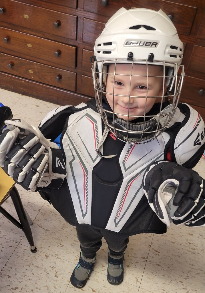 Trying on real hockey equipment and ice skating in the hal… Flickr