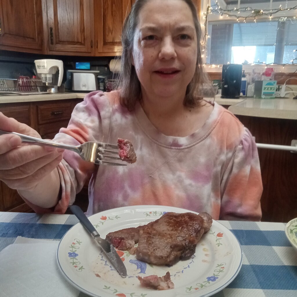 Yum ribeye steak My sister enjoying a ribeye steak that I … Flickr