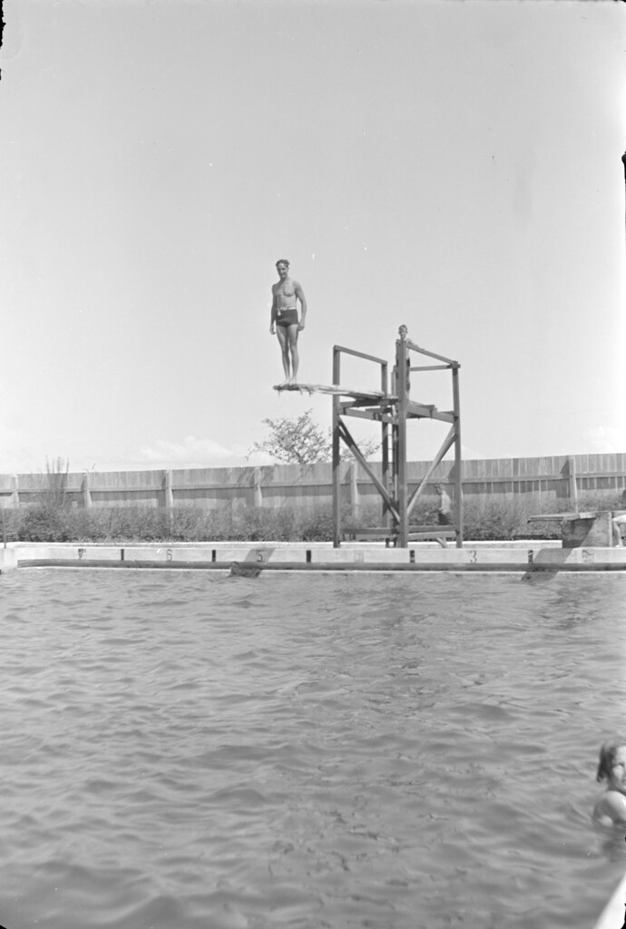 Man on the diving board at the top of the diving tower at Gladstone