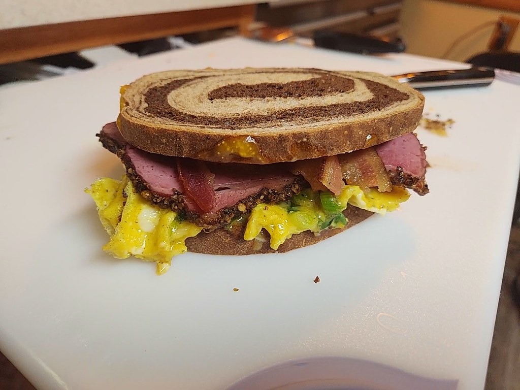 Breakfast sandwich Pastrami, bacon, egg, and swiss cheese… Flickr