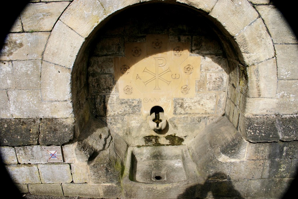 Bradford on Avon An old water fountain set into a wall . Stuart