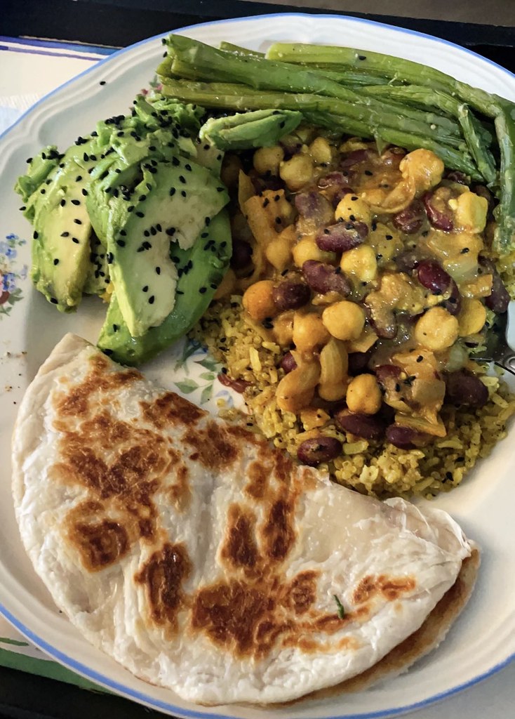 Curried kidney beans & chickpeas over brown rice with side… Flickr