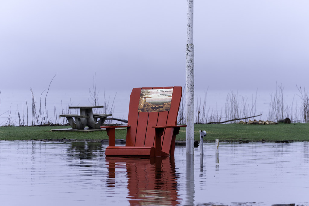 A chair submerged in water at Maiden Rock Village Park in … Flickr