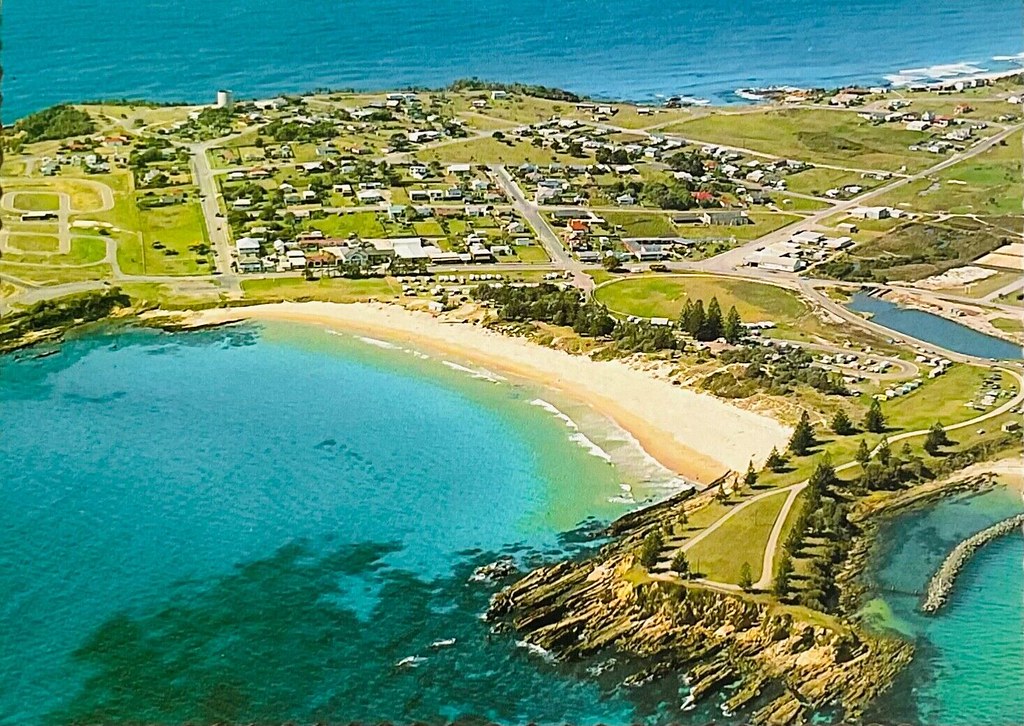 Aerial view of Bermagui and Horseshoe Bay, N.S.W. 1980s perhaps a