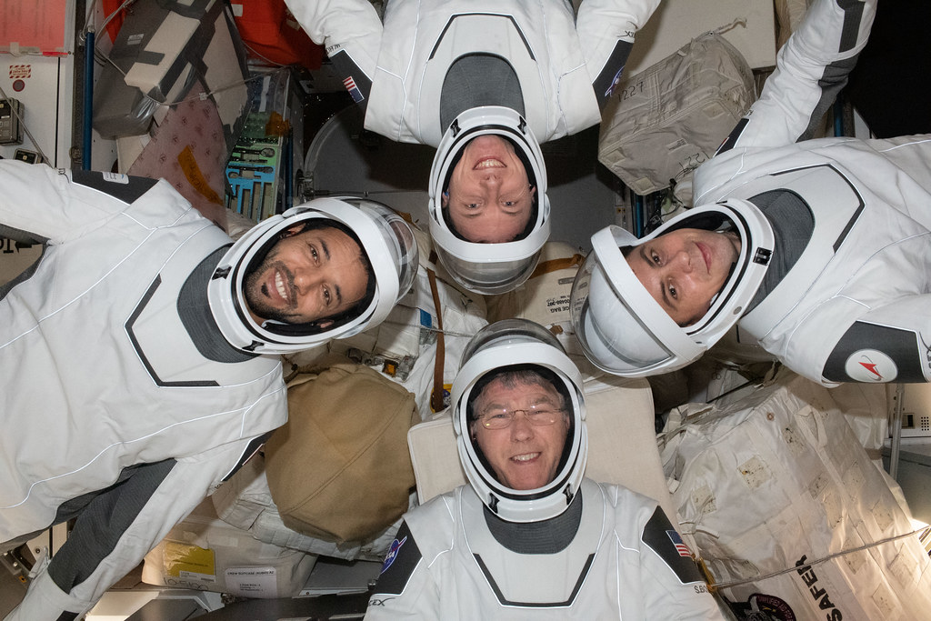 Expedition 69 crewmates pose in SpaceX pressure suits Flickr