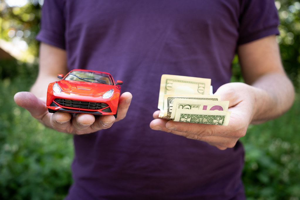 Cost of Driving in the United States Photo of a person hol… Flickr