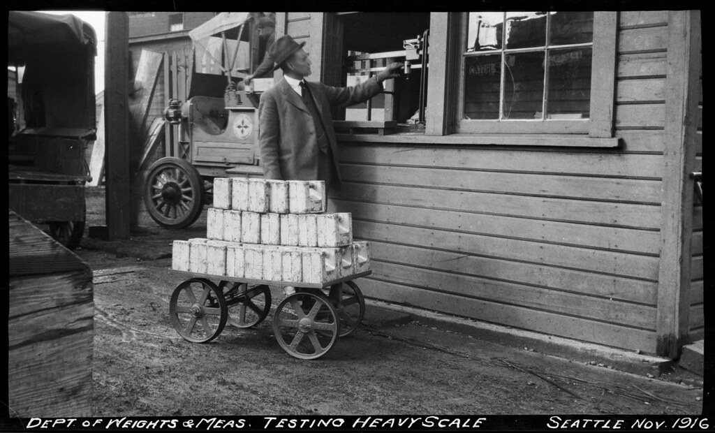 Weights and Measures inspector testing scale, 1916 Flickr